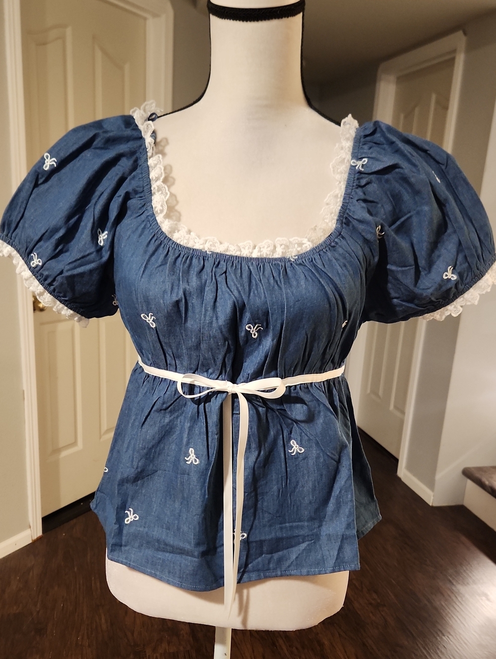 NWT Ever B Denim Bow Embroidered Baby Doll Top